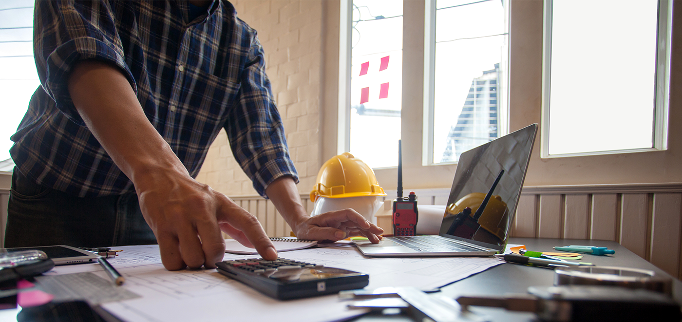 Man in construction office during a cost analysis dispute